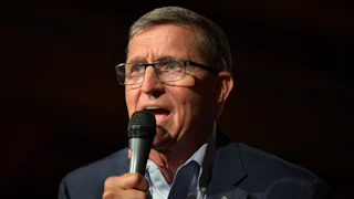 Michael Flynn speaks into a microphone