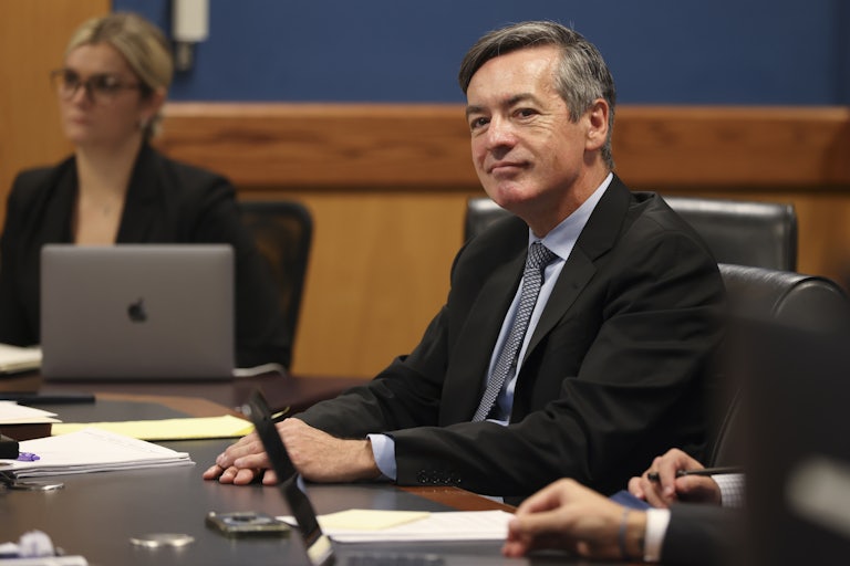 Kenneth Chesebro sits at a table