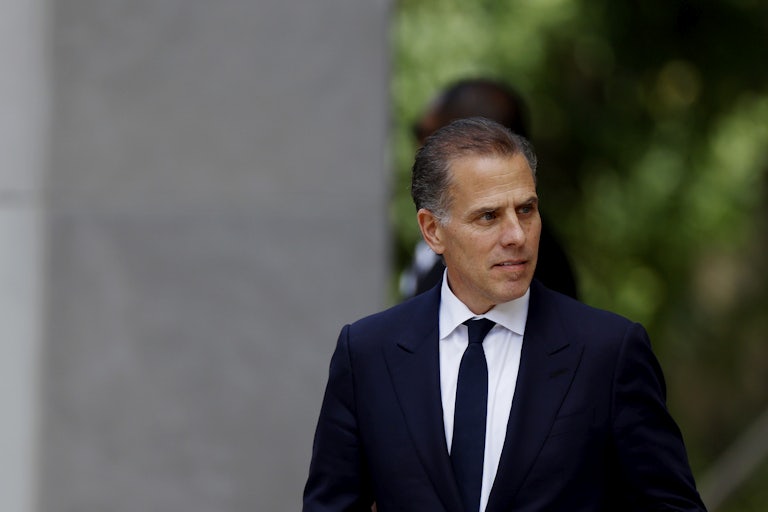 Hunter Biden looks to his side