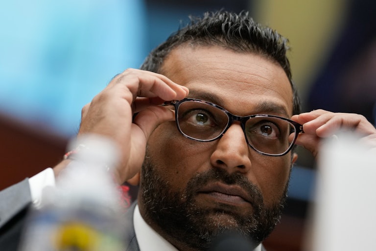 FBI Director Kash Patel adjusts his glasses during a House committee hearing
