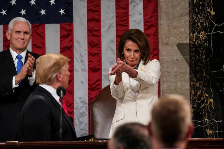Nancy Pelosi claps at Donald Trump