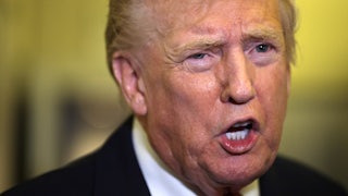 Donald Trump speaks to reporters on Air Force One
