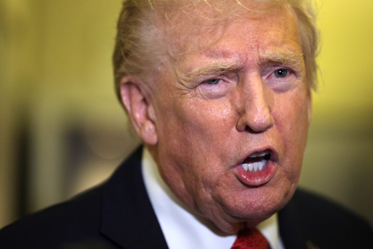 Donald Trump speaks to reporters on Air Force One