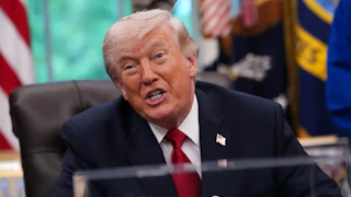 Donald Trump speaks vehemently while sitting