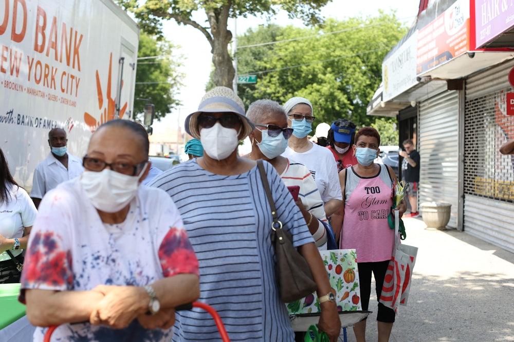 People in Queens, New York, line up to receive food