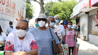 People in Queens, New York, line up to receive food