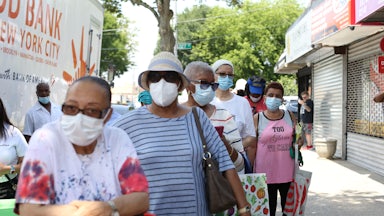 People in Queens, New York, line up to receive food