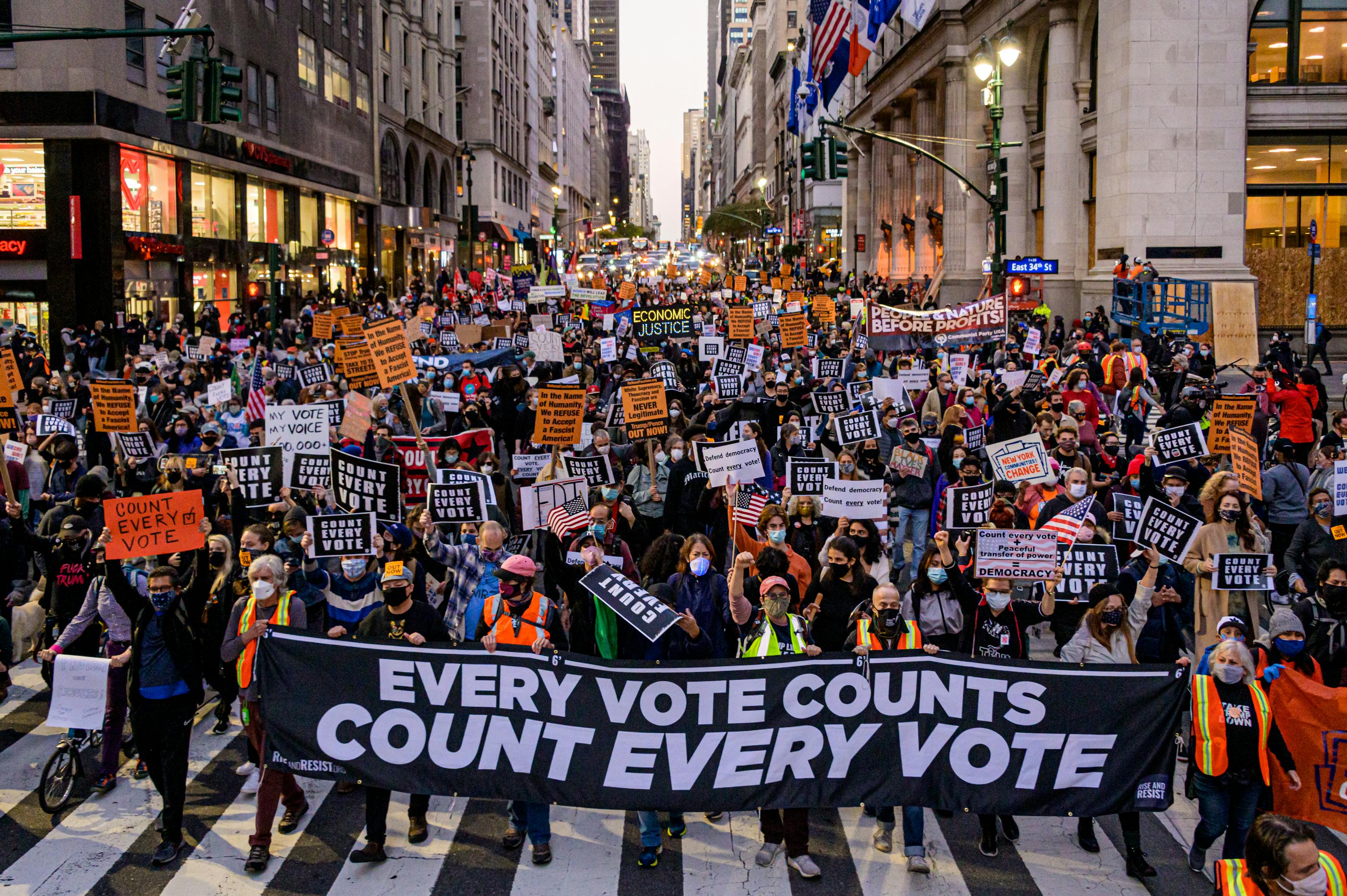 Participants holding a banner reading: "EVERY VOTE COUNTS/COUNT EVERY VOTE" at a protest in New York on November 4, 2020.