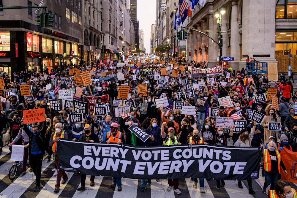 Participants holding a banner reading: "EVERY VOTE COUNTS/COUNT EVERY VOTE" at a protest in New York on November 4, 2020.