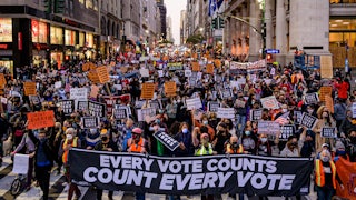 Participants holding a banner reading: "EVERY VOTE COUNTS/COUNT EVERY VOTE" at a protest in New York on November 4, 2020.