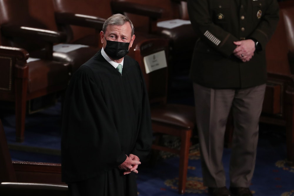 A close up of a masked John Roberts.