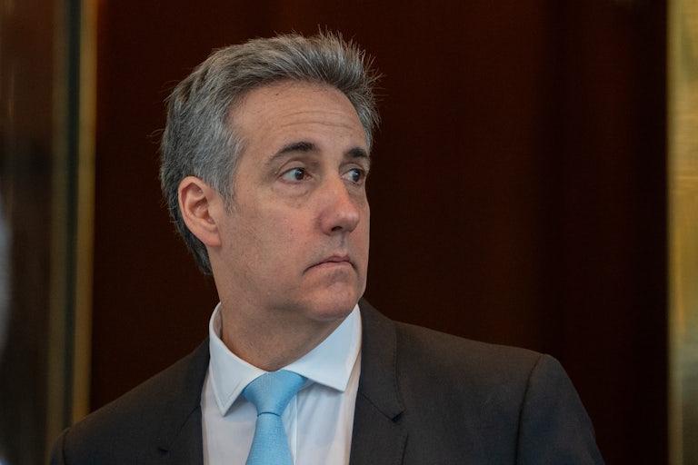 Michael Cohen looks to the side