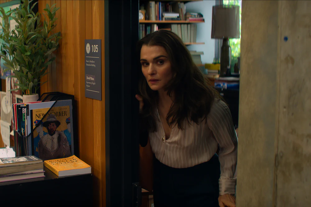 Rachel Weisz poking her head out of the door of an office in “Vladimir”