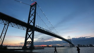 The existing Ambassador Bridge connecting Michigan to Ontario. The new Windsor to Detroit Bridge, named the Gordie Howe Bridge will be built down river from the Ambassador Bridge.