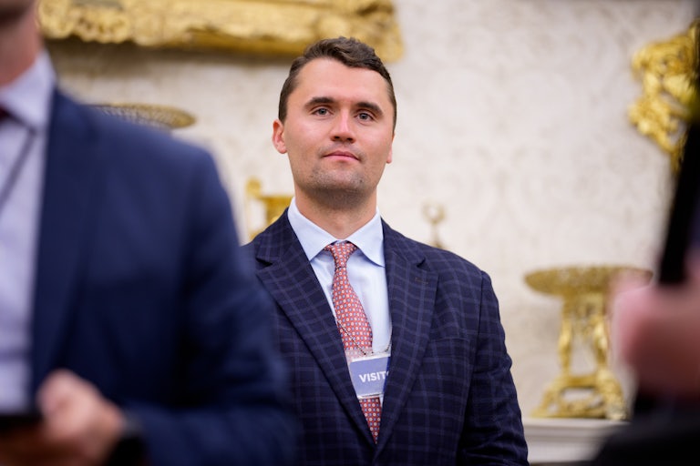 Charlie Kirk stands in the Oval Office