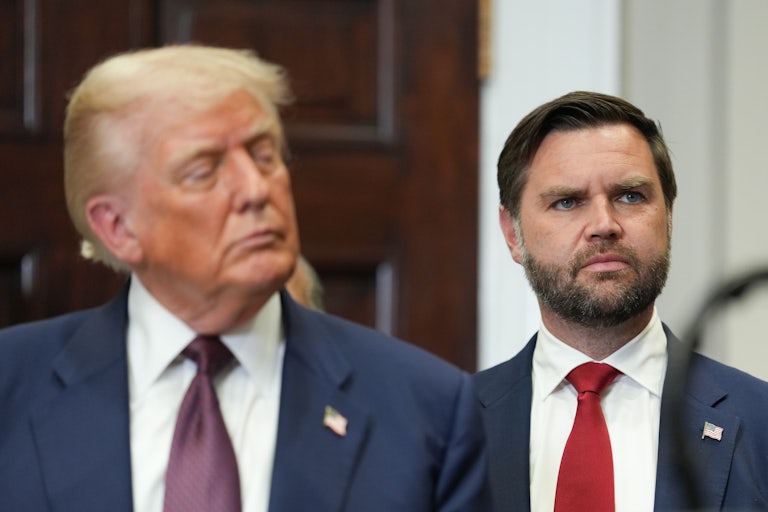 Vice President JD Vance stands behind Donald Trump