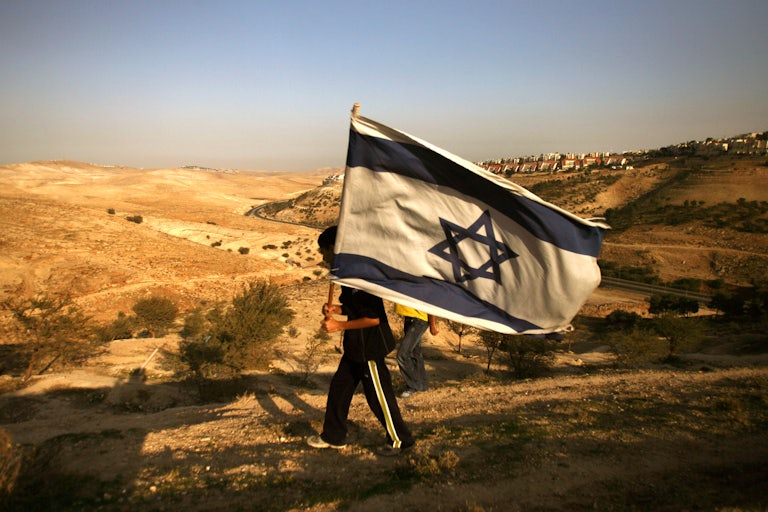 An Israeli settler at a new settlement area in the West Bank 