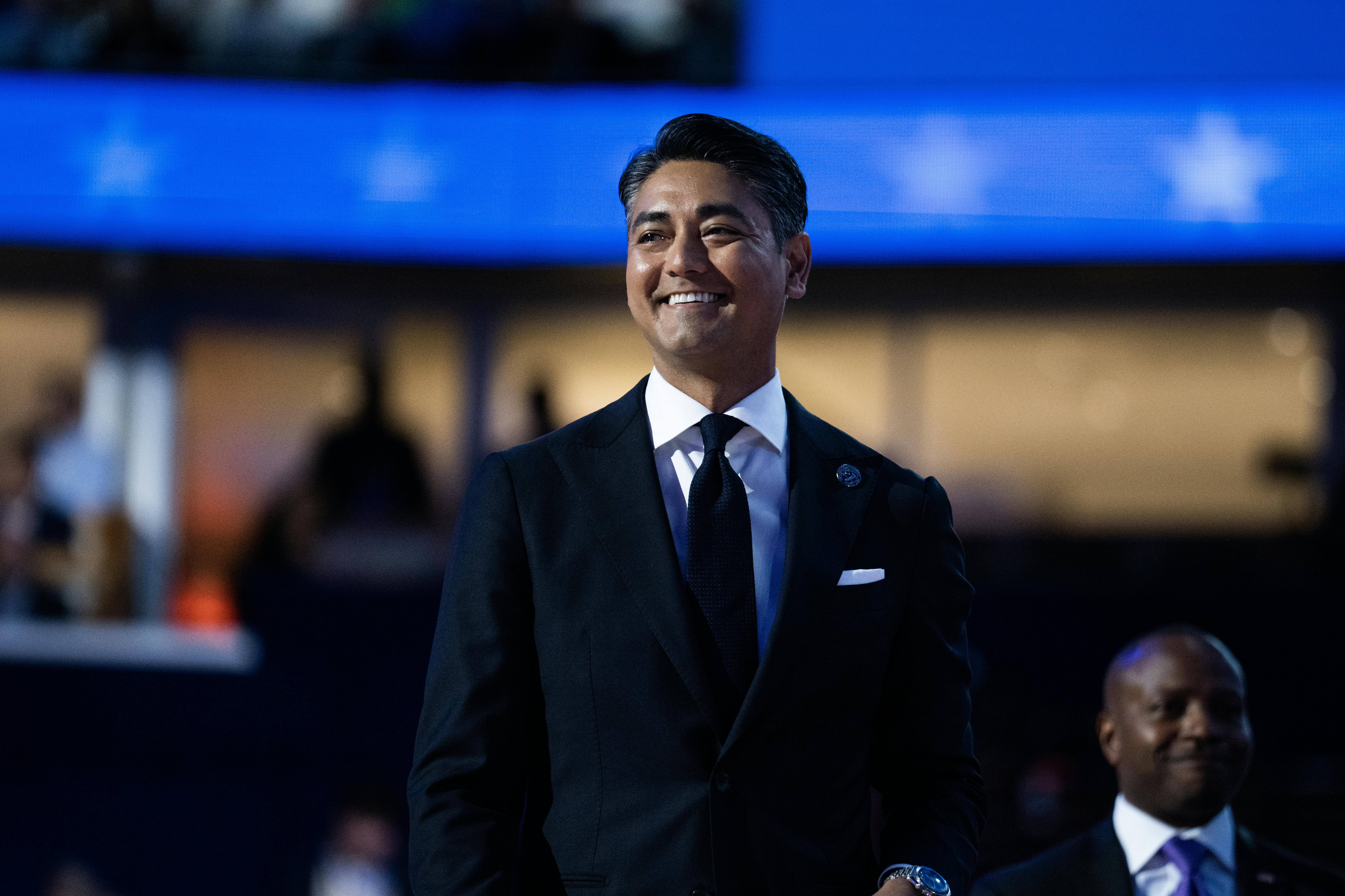 Cincinnati Mayor Aftab Pureval smiles and walks at the DNC