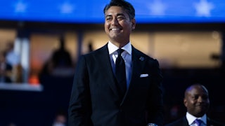 Cincinnati Mayor Aftab Pureval smiles and walks at the DNC