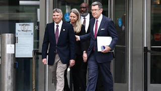 Former Olympian David Hearn walks with his attorney Norman Eisen outside Moultrie Courthouse on July 9 in Washington, D.C.