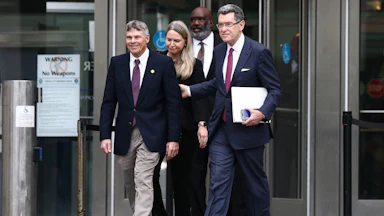 Former Olympian David Hearn walks with his attorney Norman Eisen outside Moultrie Courthouse on July 9 in Washington, D.C.