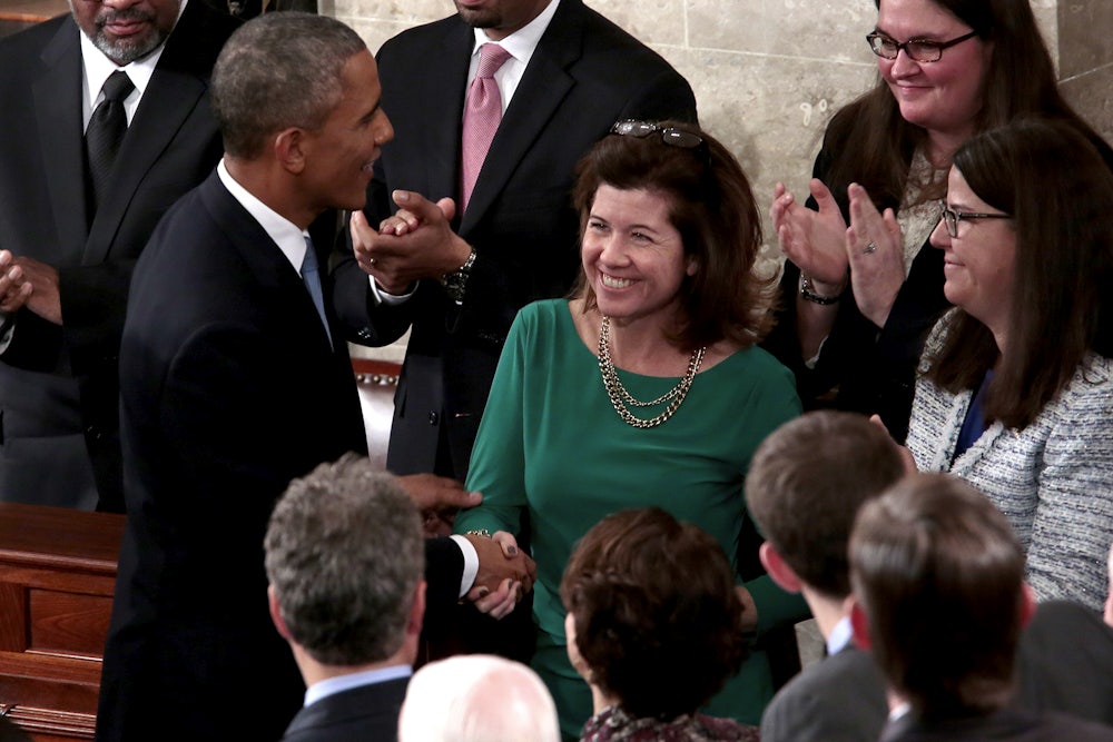 A smiling Elizabeth MacDonough shakes the hand of President Barack Obama after his 2015 State of the Union address.