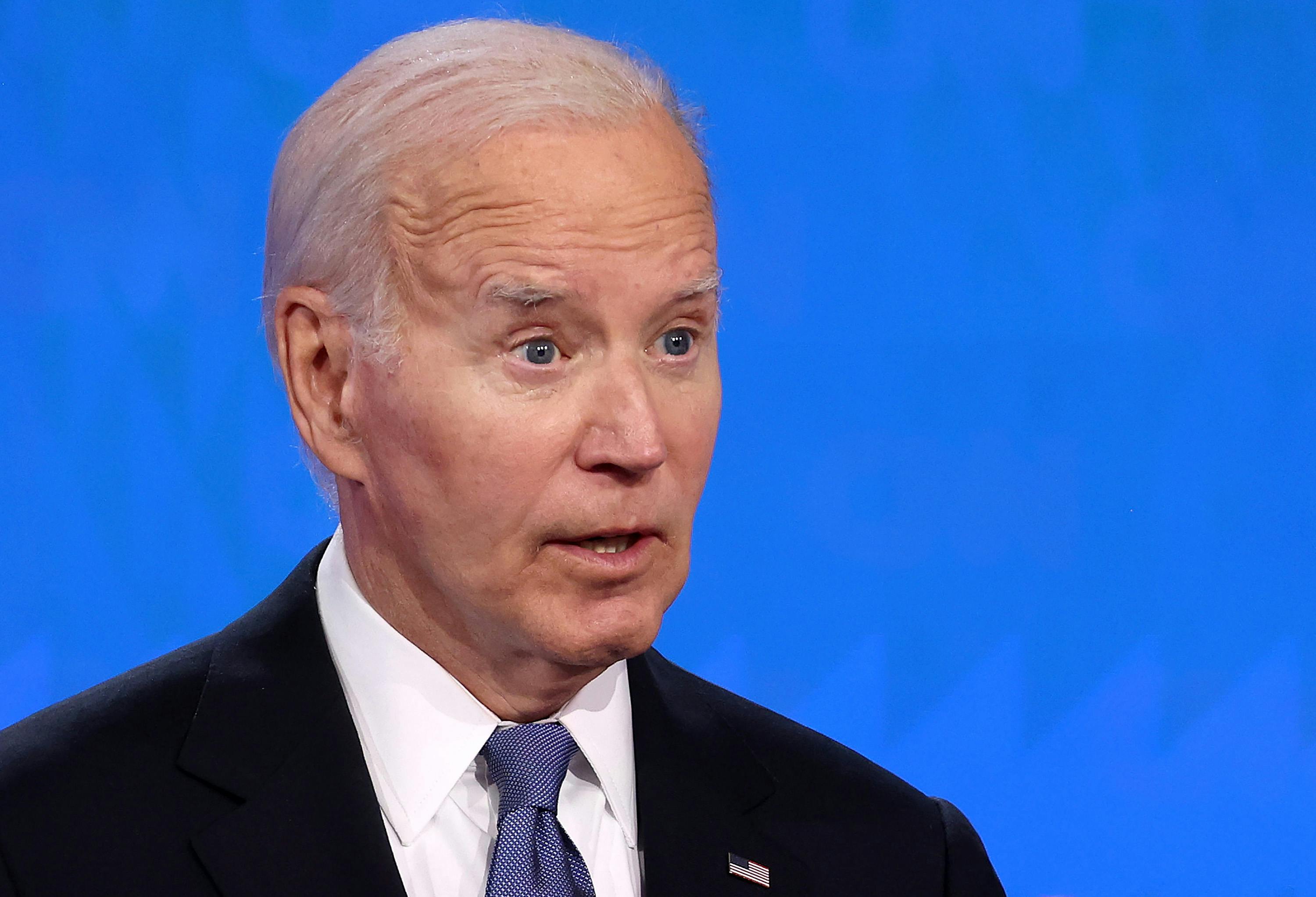 Joe Biden speaks in front of a blue background at Thursday's presidential debate.