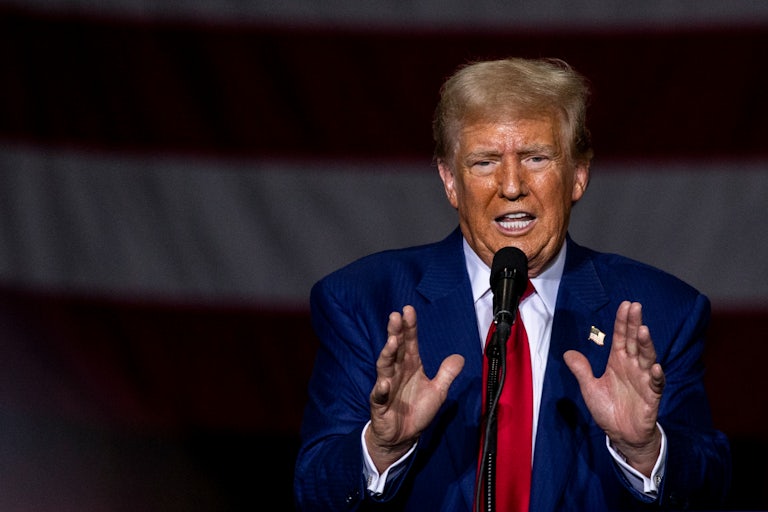 Donald Trump gestures while speaking at a campaign event