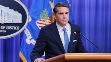 Deputy Attorney General Todd Blanche speaks at a podium