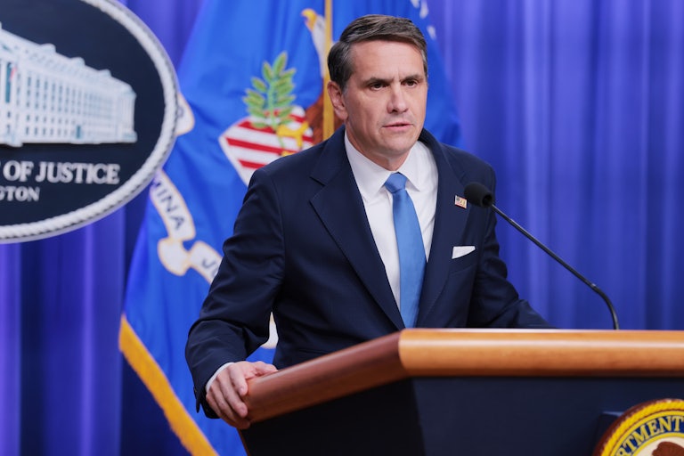 Deputy Attorney General Todd Blanche speaks at a podium