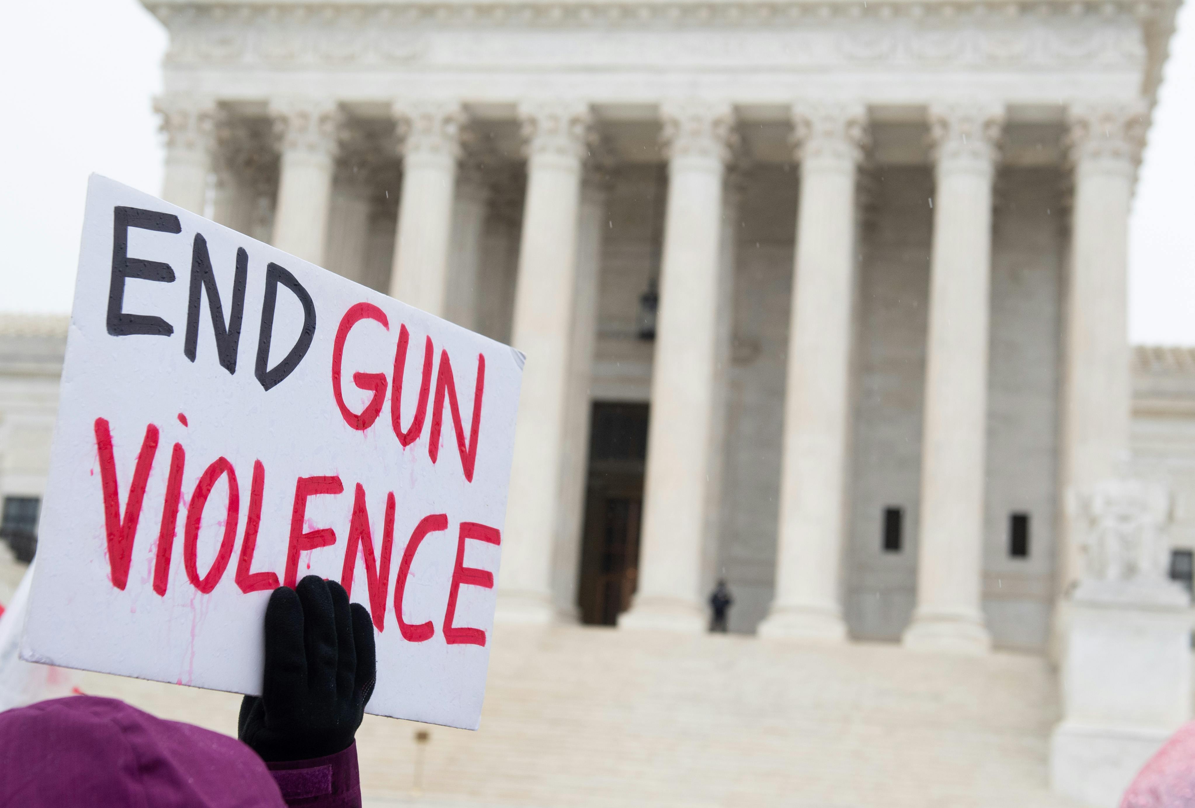 Supporters of gun control and firearm-safety measures hold a protest rally outside the U.S. Supreme Court as the Court hears oral arguments in State Rifle and Pistol v. City of New York, NY, in Washington, DC, December 2, 2019. - The case marks the first time in nearly 10 years that the Supreme Court has heard a Second Amendment gun ownership case. (Photo by SAUL LOEB / AFP) (Photo by SAUL LOEB/AFP via Getty Images)