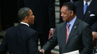 Jesse Jackson shakes hands with Barack Obama.