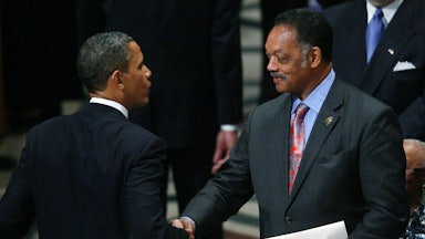 Jesse Jackson shakes hands with Barack Obama.