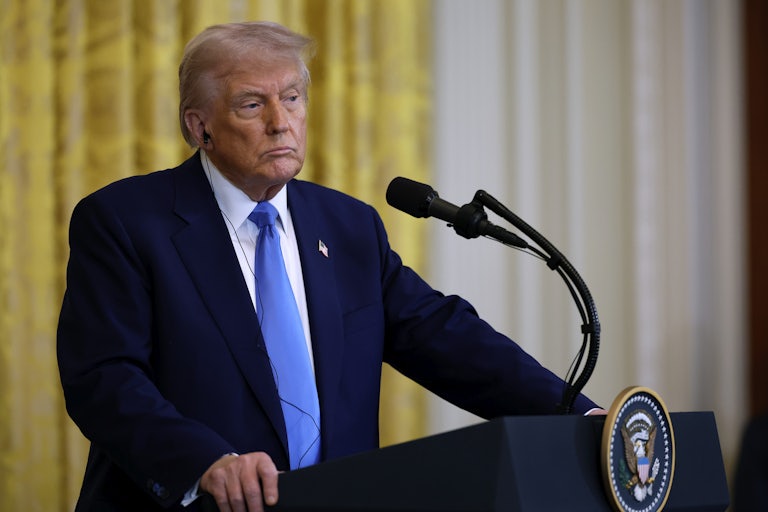 Donald Trump looks bored at the presidential podium.