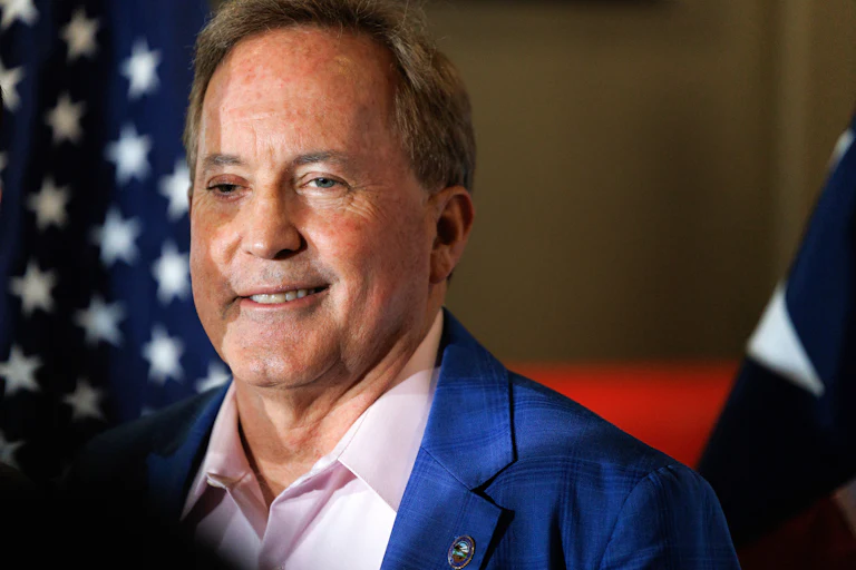 Texas Attorney General Ken Paxton smiles during a campaign event