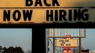 Restaurant signs that say “now hiring” in Rehoboth Beach, Delaware