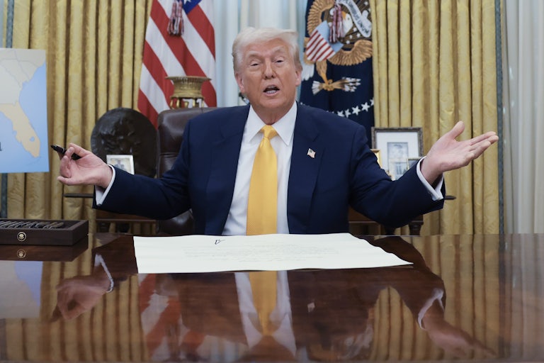 Donald Trump shrugs while speaking in the Oval Office