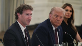 Meta CEO Mark Zuckerberg speaks as U.S. President Donald Trump and first lady Melania Trump listen, all three sitting side by side.