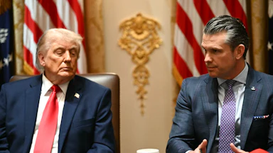 President Donald Trump listens as Defense Secretary Pete Hegseth speaks during a Cabinet meeting