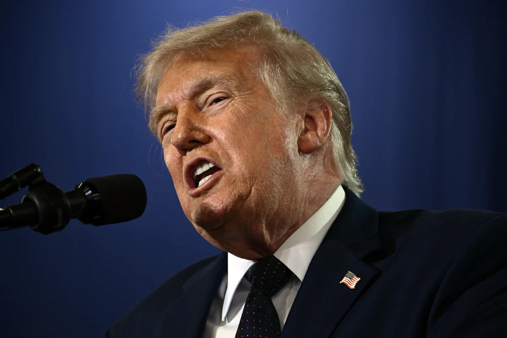 Donald Trump grimaces while speaking