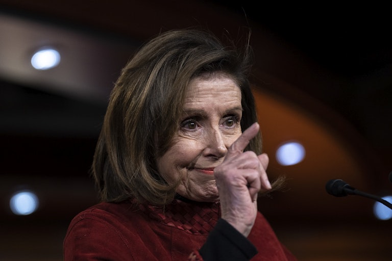 Nancy Pelosi points with her index finger