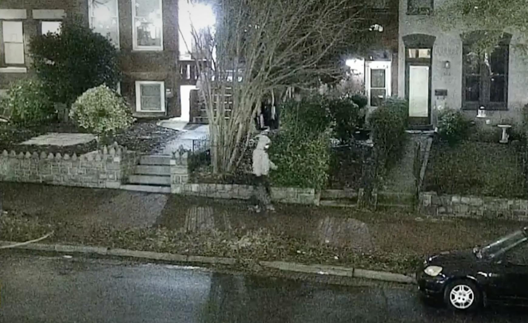 Jan. 5 pipe bombing suspect wears a gray hoodie and a face mask and walks in the streets of Washington, D.C. carrying a bag.