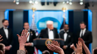 Reporters and members of the media raise their hand to ask a question to President Donald Trump during a press conference in the Brady Briefing Room of the White House following the cancellation of the annual White House Correspondents Association Dinner.