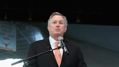 CEO Tim Leiweke speaks at a podium