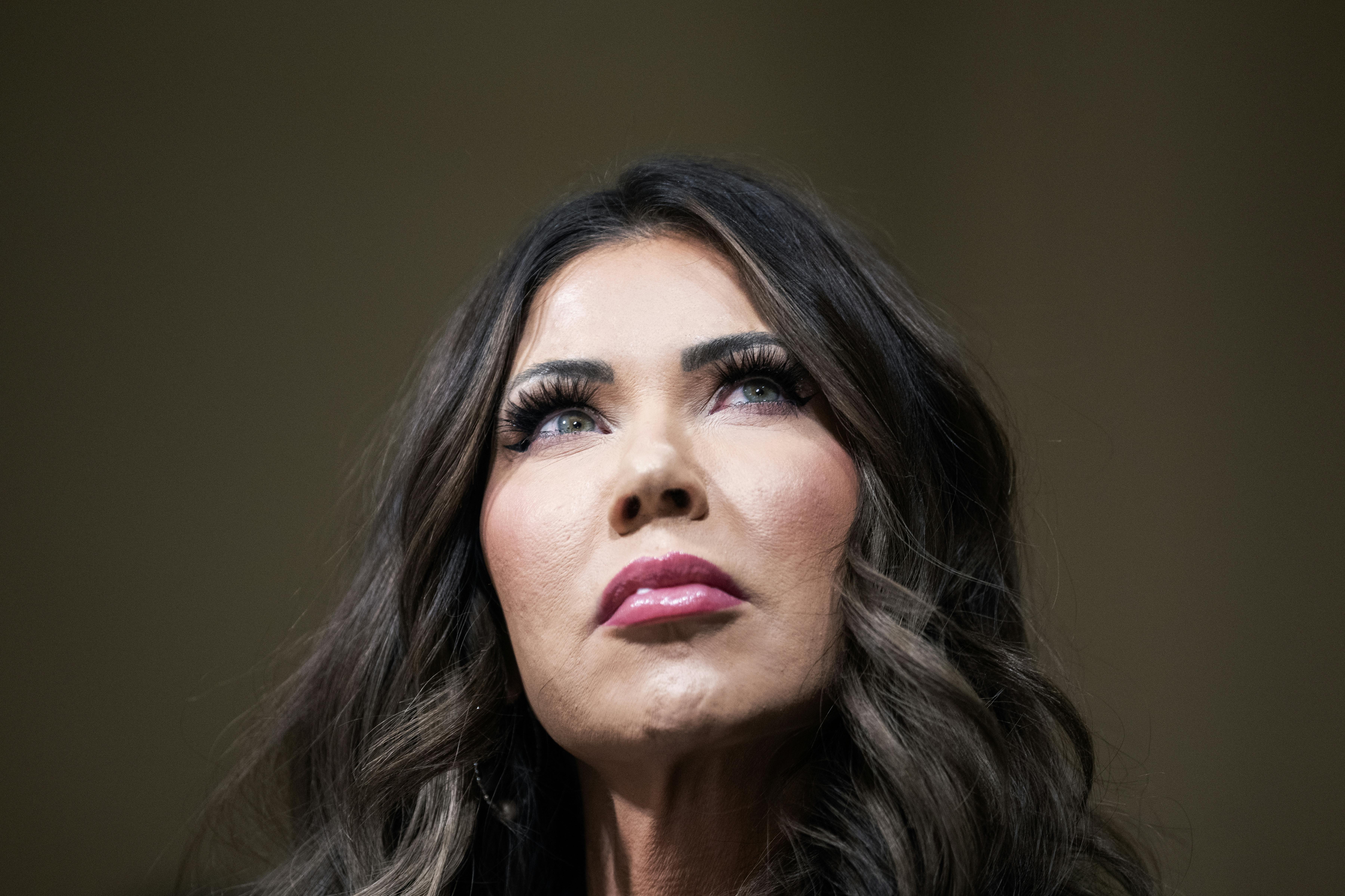Homeland Security Secretary Kristi Noem looks up during a House hearing