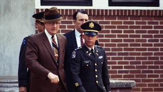 Lieutenant William Calley leaves military court with his civilian attorney.