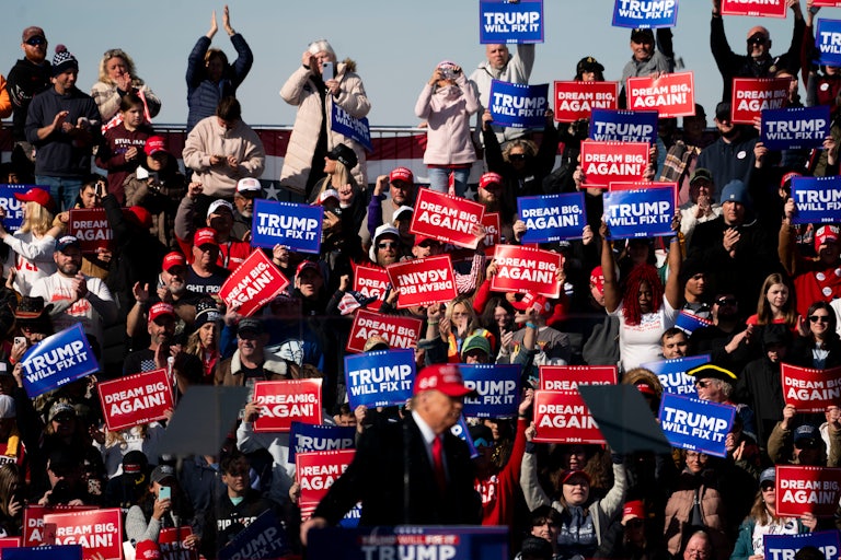Donald Trump’s supporters hold up signs during a campaign rally in Pennsylvania