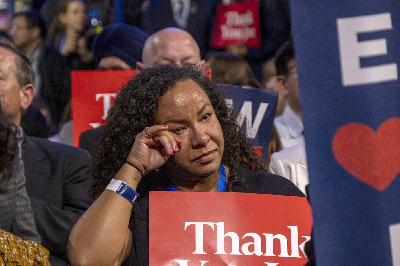 A delegate wipes a tear from her eye after listening to President Joe Biden's speech on Monday night. 