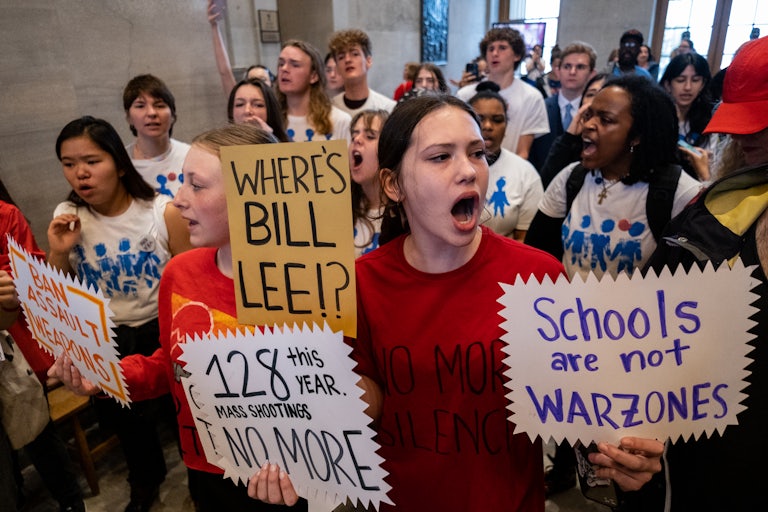 Signs read "Where's Bill Lee?," "Schools are not warzones," "Ban assault weapons," and "128 this year. Mass shootings no more."