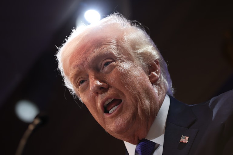 Donald Trump speaks into a microphone